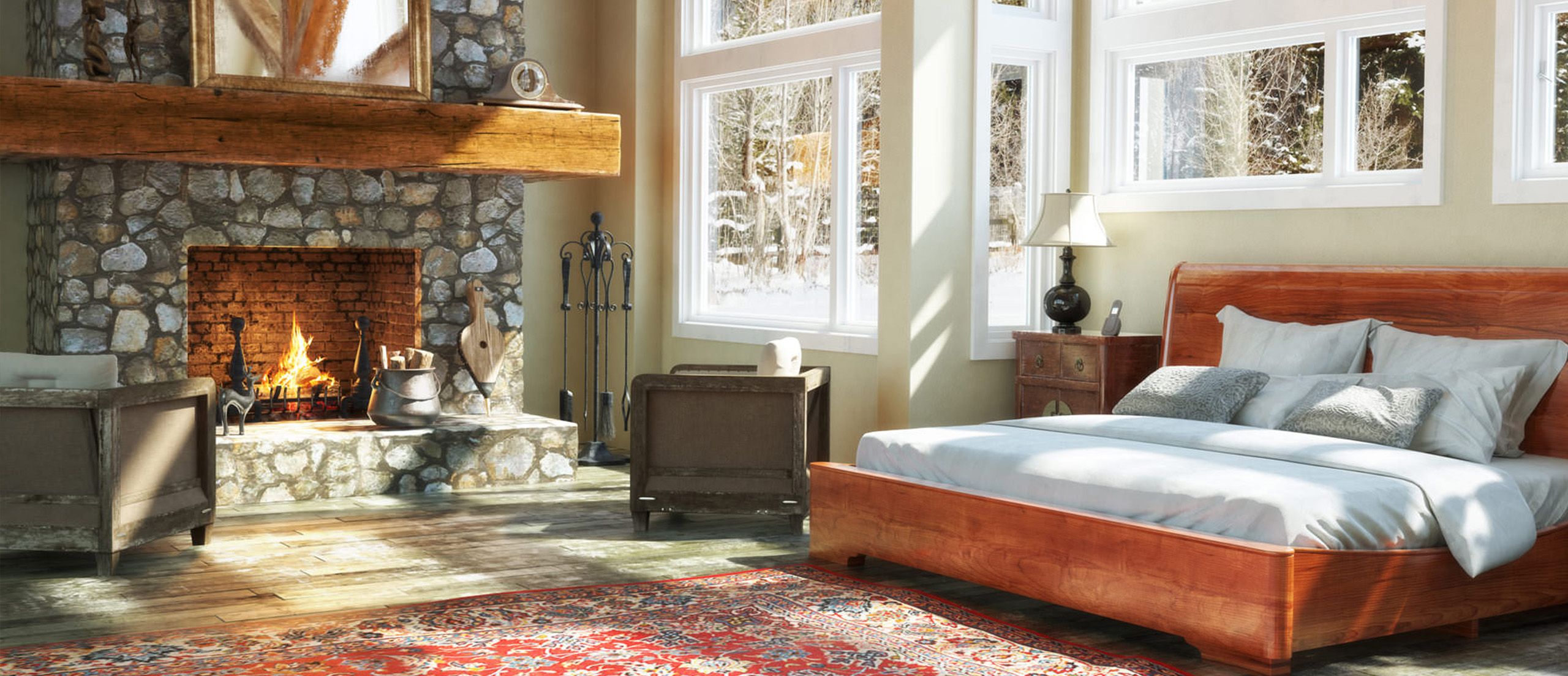 Gemütliches Schlafzimmer mit einem Bett neben einem offenem Kamin